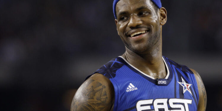 FILE - East All-Star LeBron James of the Cleveland Cavaliers smiles during the NBA All-Star basketball game Sunday, Feb. 14, 2010, at Cowboys Stadium in Arlington, Texas. (AP Photo/LM Otero, File)