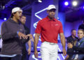 Tiger Woods and son Charlie prepare for Tuesday night's TGL match. (Megan Briggs/TGL/TGL via Getty Images)