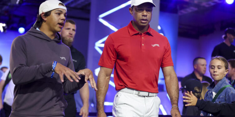 Tiger Woods and son Charlie prepare for Tuesday night's TGL match. (Megan Briggs/TGL/TGL via Getty Images)