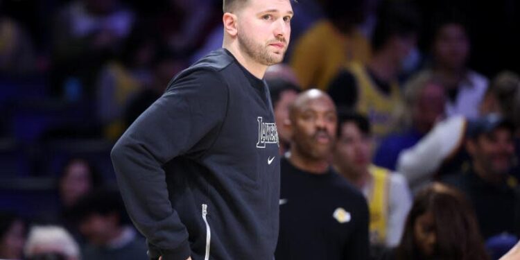 Los Angeles, California February 6, 2025-Lakers Luka Doncic watches the game from the bench during a game with the Warriors at Crypto.com Arena Thursday. (Wally Skalij/Los Angeles Times)