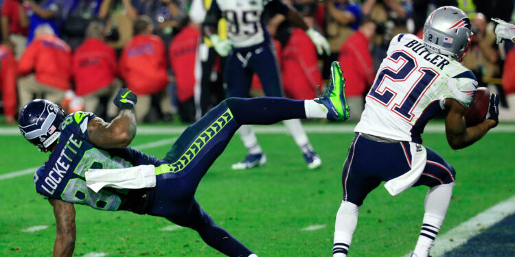 GLENDALE, AZ - FEBRUARY 01:  Malcolm Butler #21 of the New England Patriots intercepts a pass by  Russell Wilson #3 of the Seattle Seahawks intended for  Ricardo Lockette #83 late in the fourth quarter during Super Bowl XLIX at University of Phoenix Stadium on February 1, 2015 in Glendale, Arizona.  (Photo by Rob Carr/Getty Images)