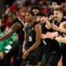 Michigan State guard Tre Holloman (5) and teammates celebrate after he made a game-winning basket to win the game at the buzzer during the second half of an NCAA college basketball game against Maryland, Wednesday, Feb. 26, 2025, in College Park, Md. (AP Photo/Nick Wass)