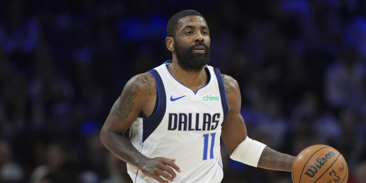 Dallas Mavericks' Kyrie Irving plays during an NBA basketball game, Tuesday, Feb. 4, 2025, in Philadelphia. (AP Photo/Matt Slocum)