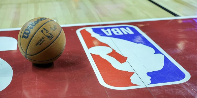 Basketball sits next to NBA logo