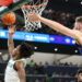 WACO, TX - FEBRUARY 01: Baylor Bears guard Robert Wright III (1) leaps for a reverse layup after driving past Kansas Jayhawks center Hunter Dickinson (1) during the Big 12 college basketball game between Baylor Bears and Kansas Jayhawks on February 1, 2025, at Foster Pavilion in Waco, Texas. (Photo by David Buono/Icon Sportswire via Getty Images)