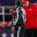 Andy Reid talks to a referee