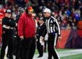 Andy Reid talks to an official