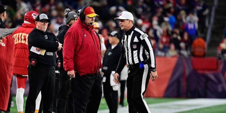 Andy Reid talks to an official