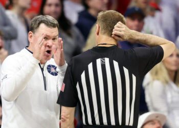 TUCSON, ARIZONA - FEBRUARY 15: Head coach Tommy Lloyd of the Arizona Wildcats gestures to referee Gregory Nixon during the game against the Houston Cougars at McKale Center on February 15, 2025 in Tucson, Arizona. The Cougars defeated the Wildcats 62-58. (Photo by Chris Coduto/Getty Images)