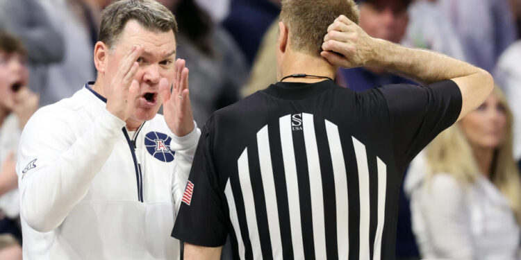 TUCSON, ARIZONA - FEBRUARY 15: Head coach Tommy Lloyd of the Arizona Wildcats gestures to referee Gregory Nixon during the game against the Houston Cougars at McKale Center on February 15, 2025 in Tucson, Arizona. The Cougars defeated the Wildcats 62-58. (Photo by Chris Coduto/Getty Images)