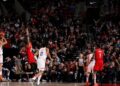 Devin Booker preparing to throw his three-pointer than broke the Phoenix Suns' scoring record.