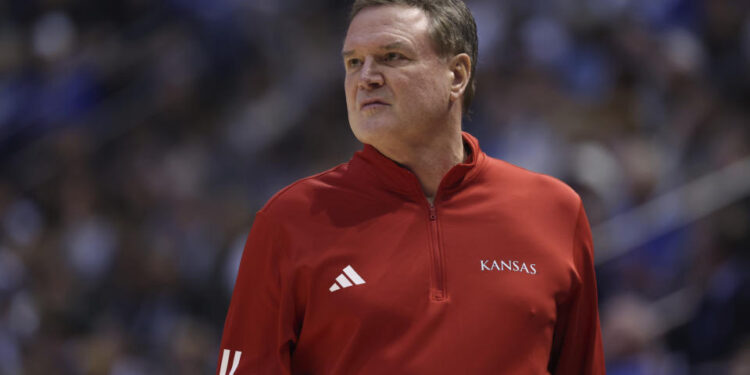 Kansas head coach Bill Self watches play against BYU during the first half of an NCAA college basketball game, Tuesday, Feb. 18, 2025, in Provo, Utah. (AP Photo/Rob Gray)