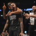 Brooklyn Nets' D'Angelo Russell (1) celebrates with teamamtes after making a three-point shot during the second half of an NBA basketball game against the Houston Rockets Tuesday, Feb. 4, 2025, in New York. (AP Photo/Frank Franklin II)