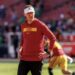 USC coach Lincoln Riley watches his team warm up before playing Notre Dame