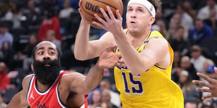 Laker Austin Reaves drives past Clipper James Harden in the second quarter at the Intuit Dome Tuesday.