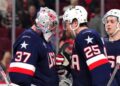 Charlie McAvoy and Connor Hellebuyck