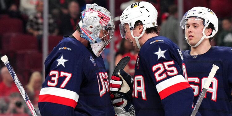 Charlie McAvoy and Connor Hellebuyck