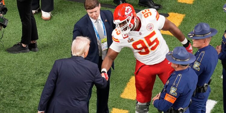 Donald Trump and Chris Jones shake hands