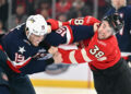 USA and Canada will meet again with higher stakes after a Saturday game produced three fights, including this one between USA's Matthew Tkachuk (No. 19) and Brandon Hagel. (Minas Panagiotakis/Getty Images)