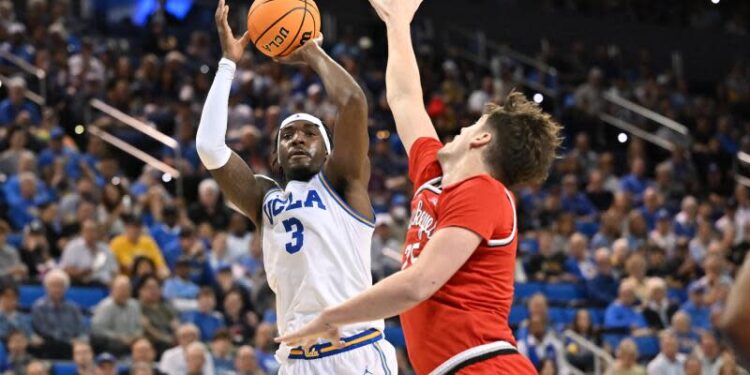 LOS ANGELES, CA - FEBRUARY 23: UCLA Bruins guard Eric Dailey Jr. (3) shoots a basket during the game between the Ohio State Buckeyes and the UCLA Bruins on February 23, 2025, at Pauley Pavilion in Los Angeles, CA. (Photo by David Dennis/Icon Sportswire via Getty Images)