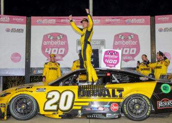 HAMPTON, GEORGIA - FEBRUARY 23: Christopher Bell, driver of the #20 DEWALT Toyota, celebrates in victory lane after winning the NASCAR Cup Series Ambetter Health 400 at Atlanta Motor Speedway on February 23, 2025 in Hampton, Georgia. (Photo by Jonathan Bachman/Getty Images)