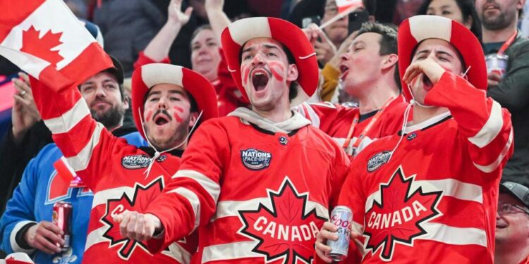 <span>Canada fans cheer their team as they take to the ice ahead of their 4 Nations Face-Off hockey game against the United States in Montreal on Saturday night.</span><span>Photograph: Graham Hughes/AP</span>