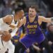 Denver Nuggets guard Russell Westbrook, left, looks to pass the ball as Los Angeles Lakers.