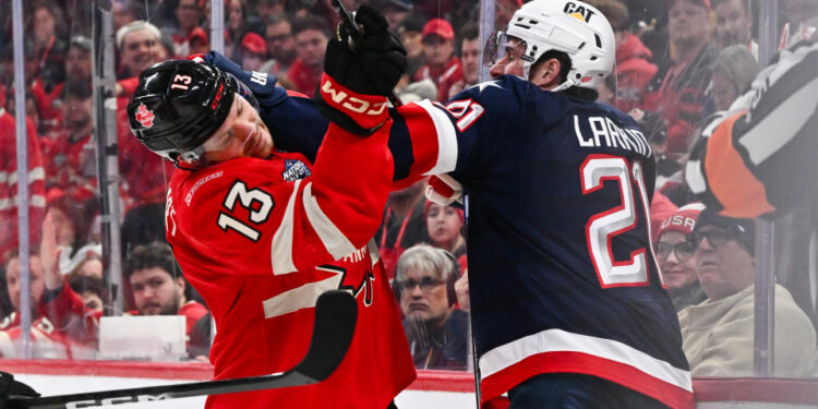 Sam Reinhart of Team Canada and Dylan Larkin of Team USA battle it out during the third period in the 2025 NHL 4 Nations Face-Off. (Photo by Minas Panagiotakis/Getty Images)