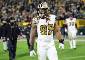 GREEN BAY, WISCONSIN - DECEMBER 23: Chase Young #99 of the New Orleans Saints leaves the field following a game against the Green Bay Packers at Lambeau Field on December 23, 2024 in Green Bay, Wisconsin.  The Packers defeated the Saints 34-0. (Photo by Stacy Revere/Getty Images)