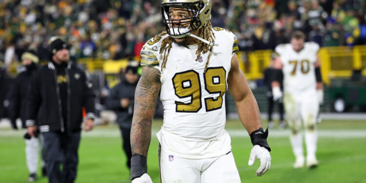 GREEN BAY, WISCONSIN - DECEMBER 23: Chase Young #99 of the New Orleans Saints leaves the field following a game against the Green Bay Packers at Lambeau Field on December 23, 2024 in Green Bay, Wisconsin.  The Packers defeated the Saints 34-0. (Photo by Stacy Revere/Getty Images)