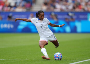 PARIS, FRANCE - AUGUST 03: Crystal Dunn #7 of the United States strikes the ball during the first half against Japan during the Women's Quarterfinal match during the Olympic Games Paris 2024 at Parc des Princes on August 03, 2024 in Paris, France. (Photo by Andrea Vilchez/ISI/Getty Images)