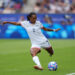 PARIS, FRANCE - AUGUST 03: Crystal Dunn #7 of the United States strikes the ball during the first half against Japan during the Women's Quarterfinal match during the Olympic Games Paris 2024 at Parc des Princes on August 03, 2024 in Paris, France. (Photo by Andrea Vilchez/ISI/Getty Images)