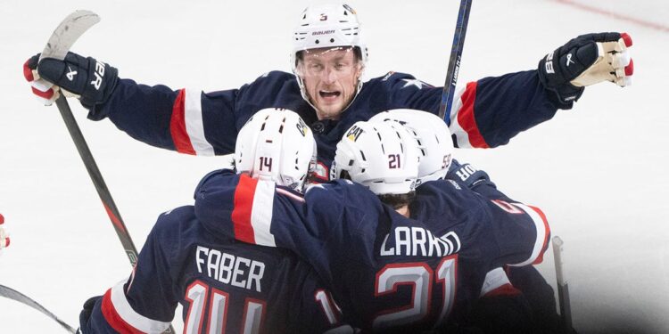 Jack Eichel celebrates