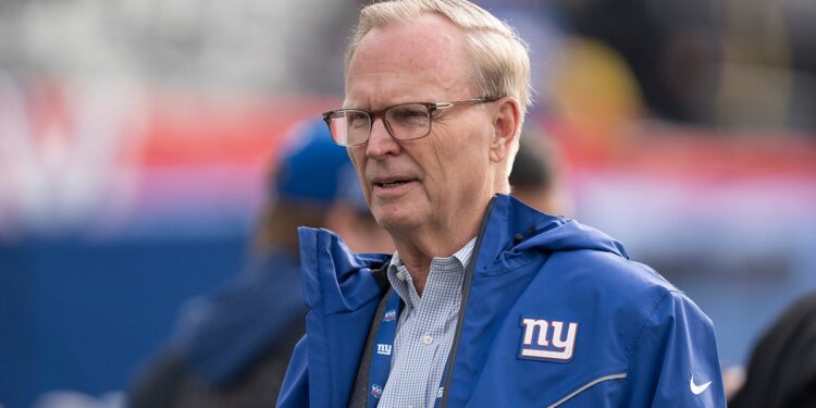 John Mara looks on