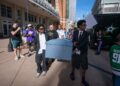 Mavericks fans carry coffin outside arena