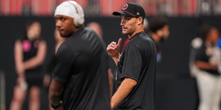 Kirk Cousins looks at Michael Penix Jr.