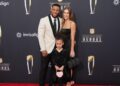 Saquon Barkley, Anna Congdon, and daughter Jada, pose on red carpet