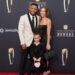 Saquon Barkley, Anna Congdon, and daughter Jada, pose on red carpet