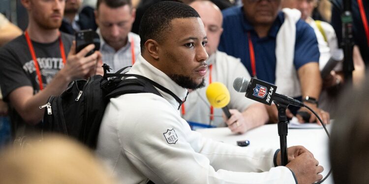 Saquon Barkley looks on