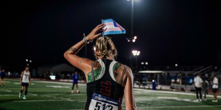 Sadie Schreiner with a trans flag