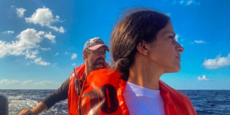 Woman and man on dinghy