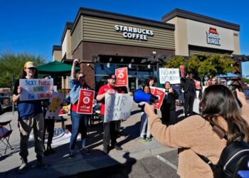 Starbucks employees strike outside their store, in Mesa, Arizona in US.