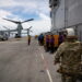 A pair of MV-22 Osprey transport aircraft are parked aboard the U.S. Navy amphibious assault ship USS Iwo Jima in the Cari...