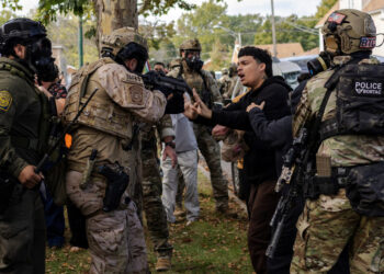 Police clash with community members after detaining a man on Chicago's South Side