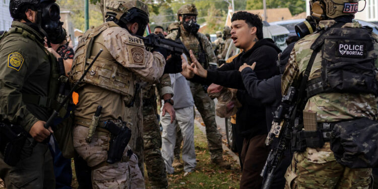 Police clash with community members after detaining a man on Chicago's South Side