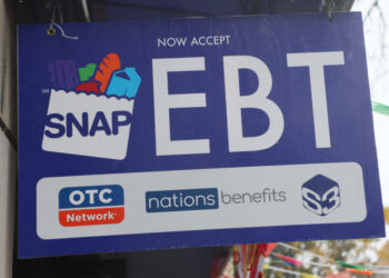 An EBT sign is displayed on the window of a grocery store on October 30, 2025 in the Flatbush neighborhood of the Brooklyn...