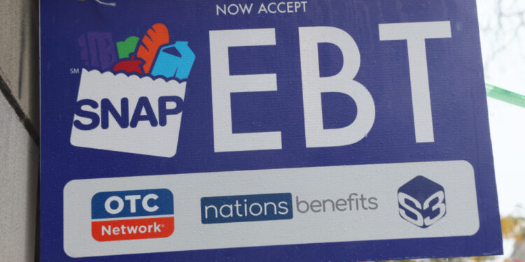 An EBT sign is displayed on the window of a grocery store on October 30, 2025 in the Flatbush neighborhood of the Brooklyn...
