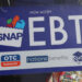 An EBT sign is displayed on the window of a grocery store on October 30, 2025 in the Flatbush neighborhood of the Brooklyn...