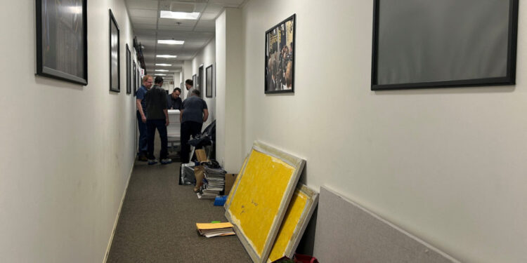 Journalists pose on the steps of the Pentagon in Washington