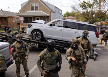 Police clash with community members after detaining a man on Chicago's South Side
